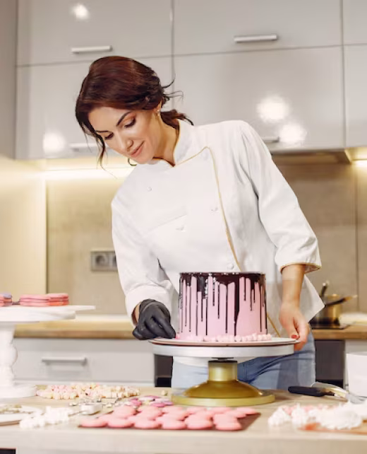 confectioner-uniform-decorates-cake_1157-33243
